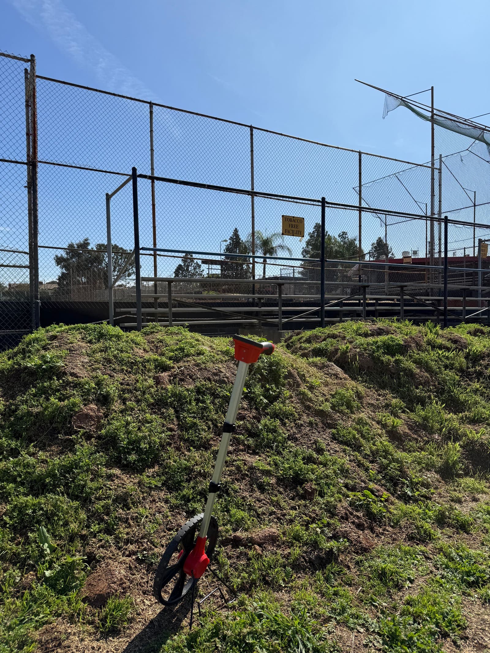 Broken perimeter fencing and overgrown weeds at Sutherland Fields before restoration.