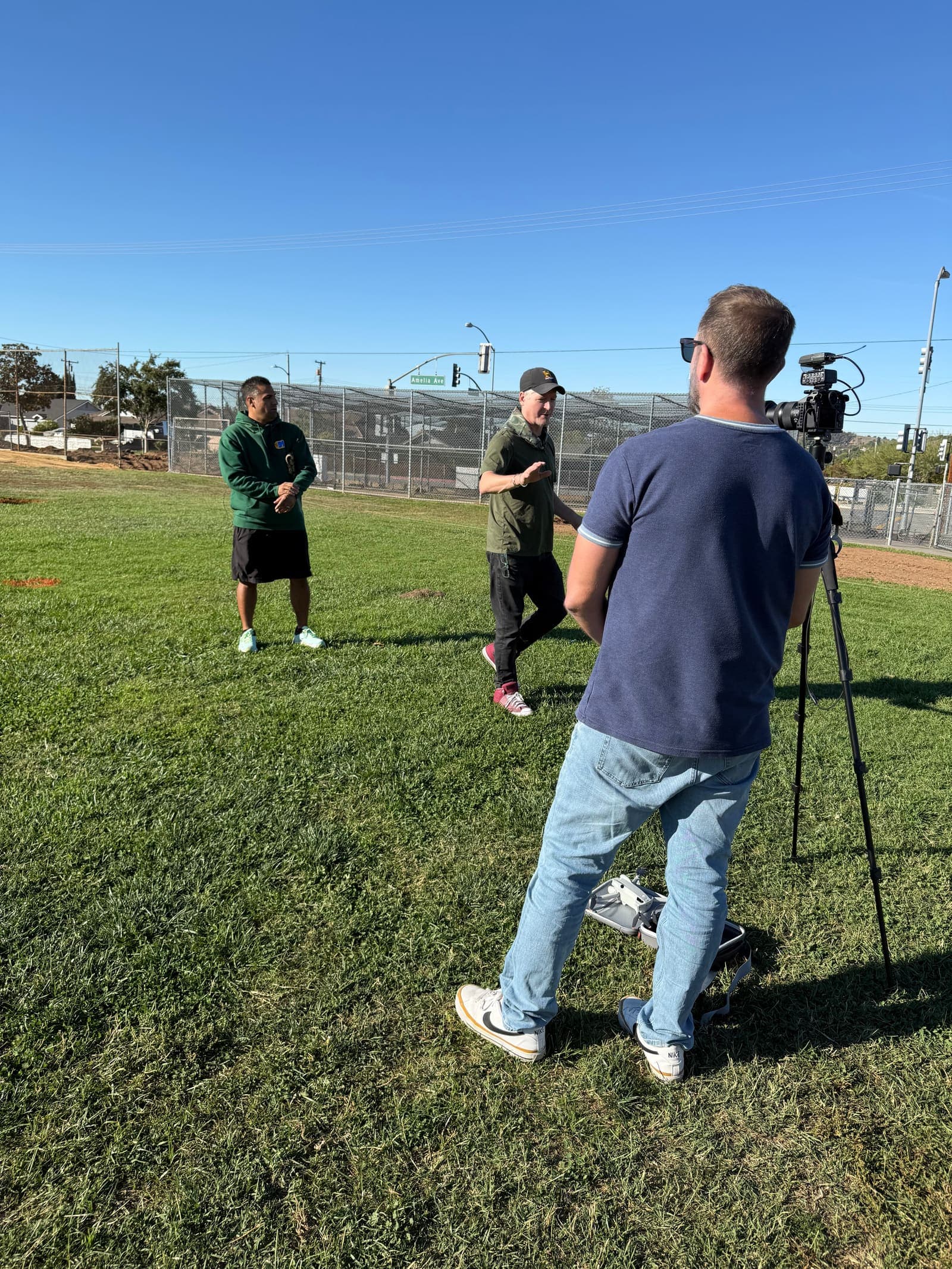 Filming an interview on the field for the project's storytelling work.